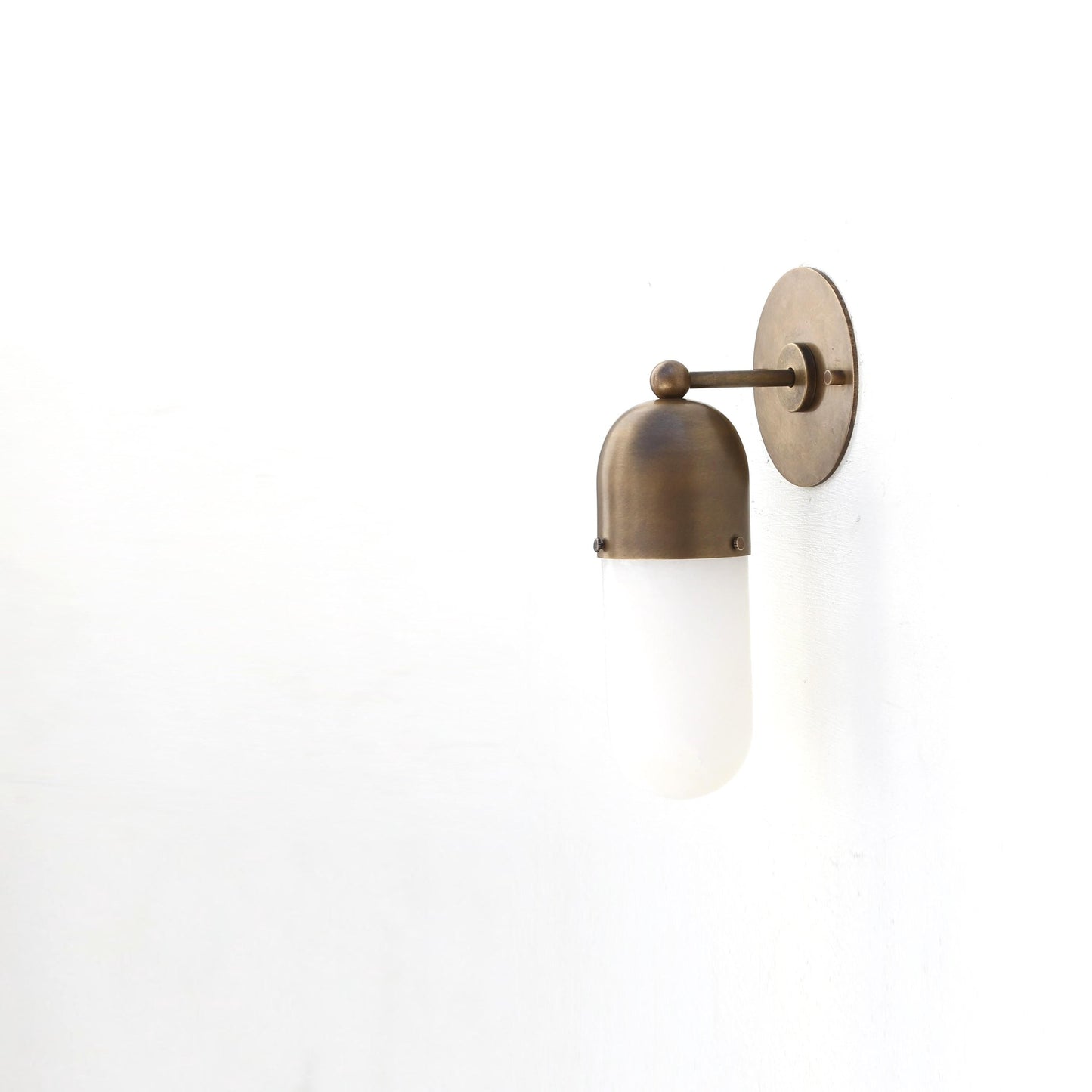 One-Light Wall Sconce with Brass Cap and Opal Glass Tube