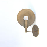 One-Light Wall Sconce with Round Brass Reflector Disc