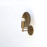 One-Light Wall Sconce with Round Brass Reflector Disc