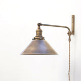 Plug-In Swing Arm Wall Sconce with Brass Cone Shade