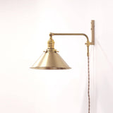 Plug-In Swing Arm Wall Sconce with Brass Cone Shade
