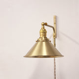 Plug-In Swing Arm Wall Sconce with Brass Cone Shade