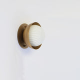 Ribbed Opal Globe Wall Sconce with Brass Half Shade