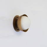 Ribbed Opal Globe Wall Sconce with Brass Half Shade