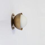 Ribbed Opal Globe Wall Sconce with Brass Half Shade