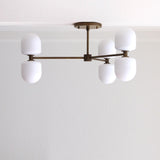Six-Light Brass Chandelier with Opal Capsule Shades