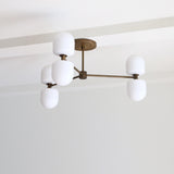 Six-Light Brass Chandelier with Opal Capsule Shades