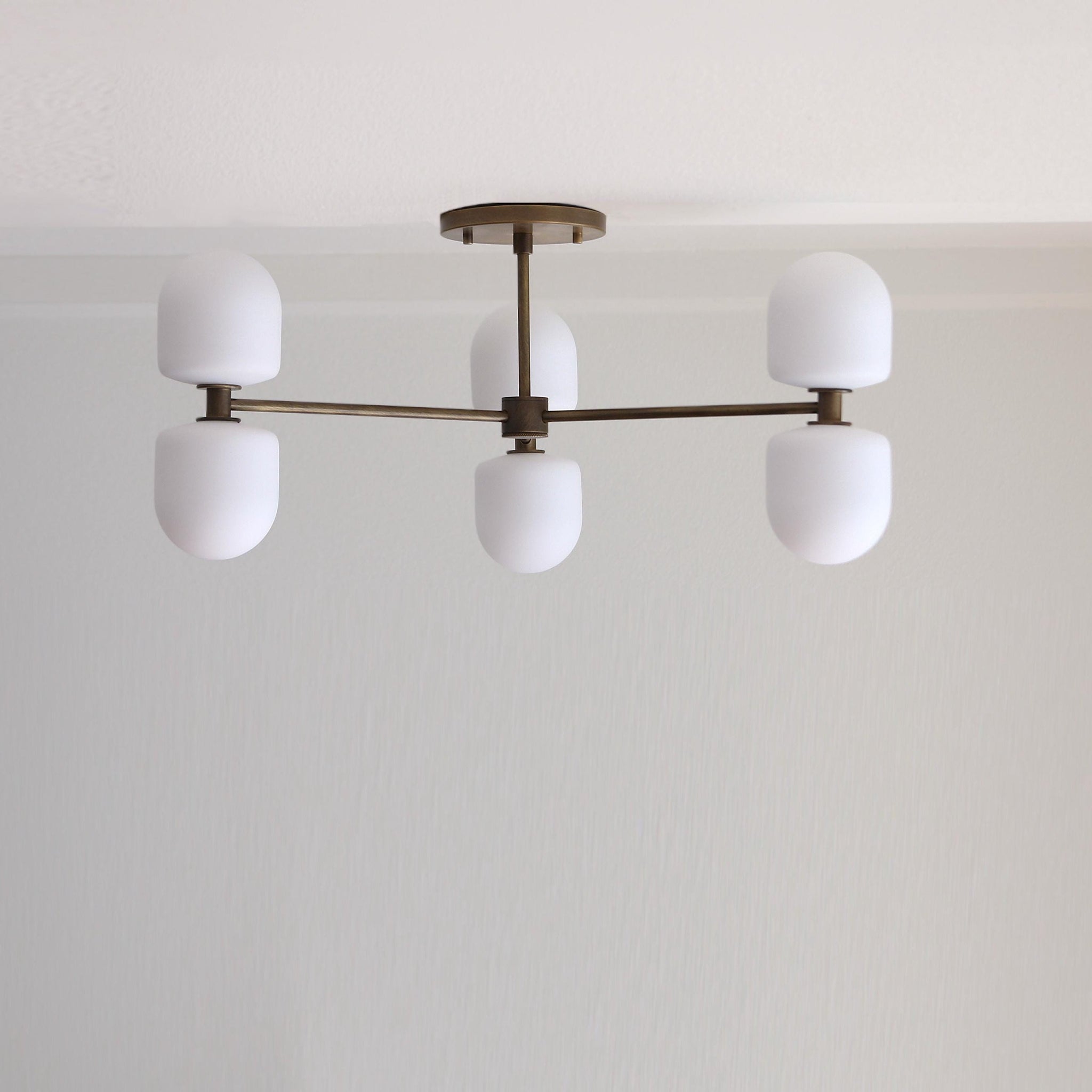 Six-Light Brass Chandelier with Opal Capsule Shades
