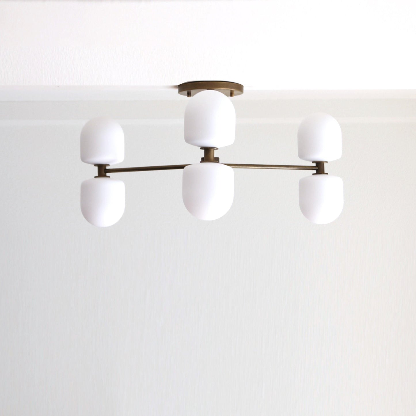 Six-Light Brass Chandelier with Opal Capsule Shades