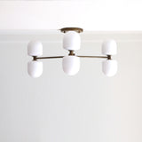Six-Light Brass Chandelier with Opal Capsule Shades