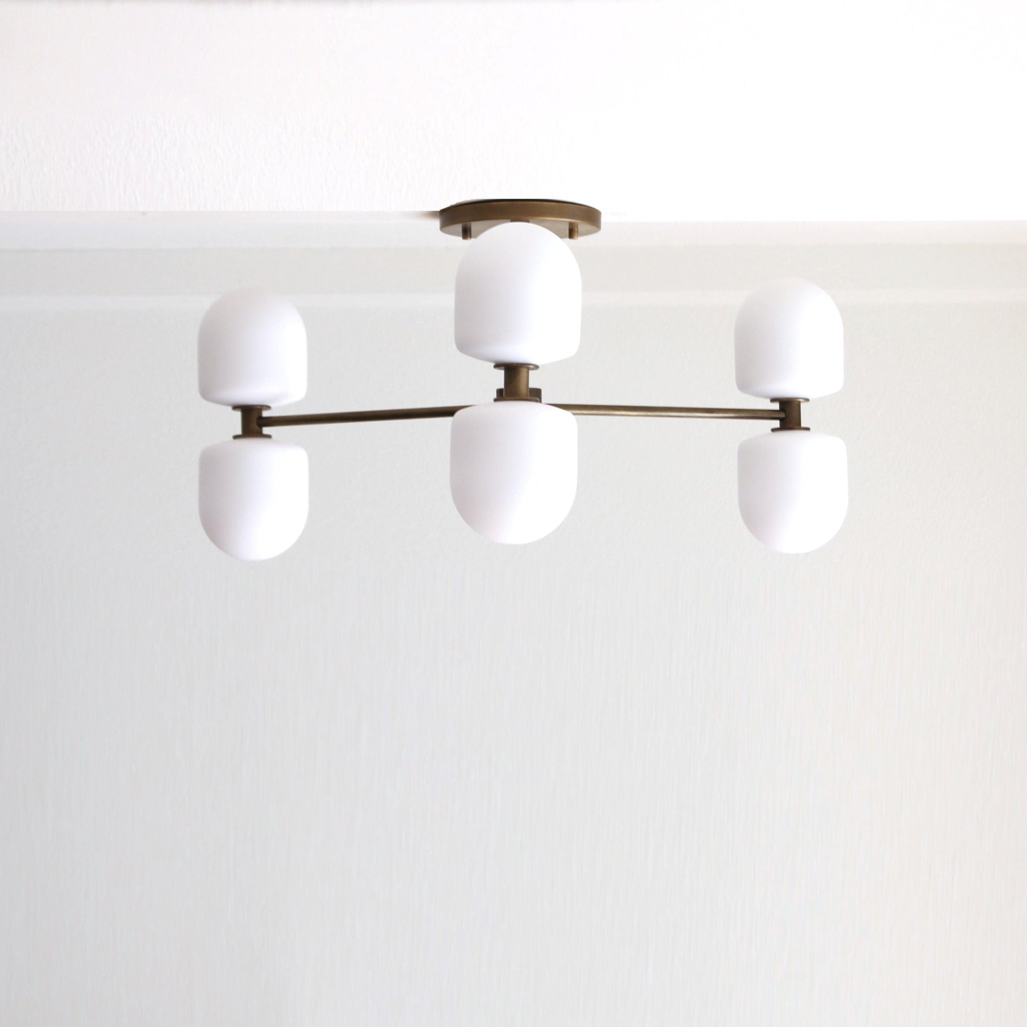 Six-Light Brass Chandelier with Opal Capsule Shades