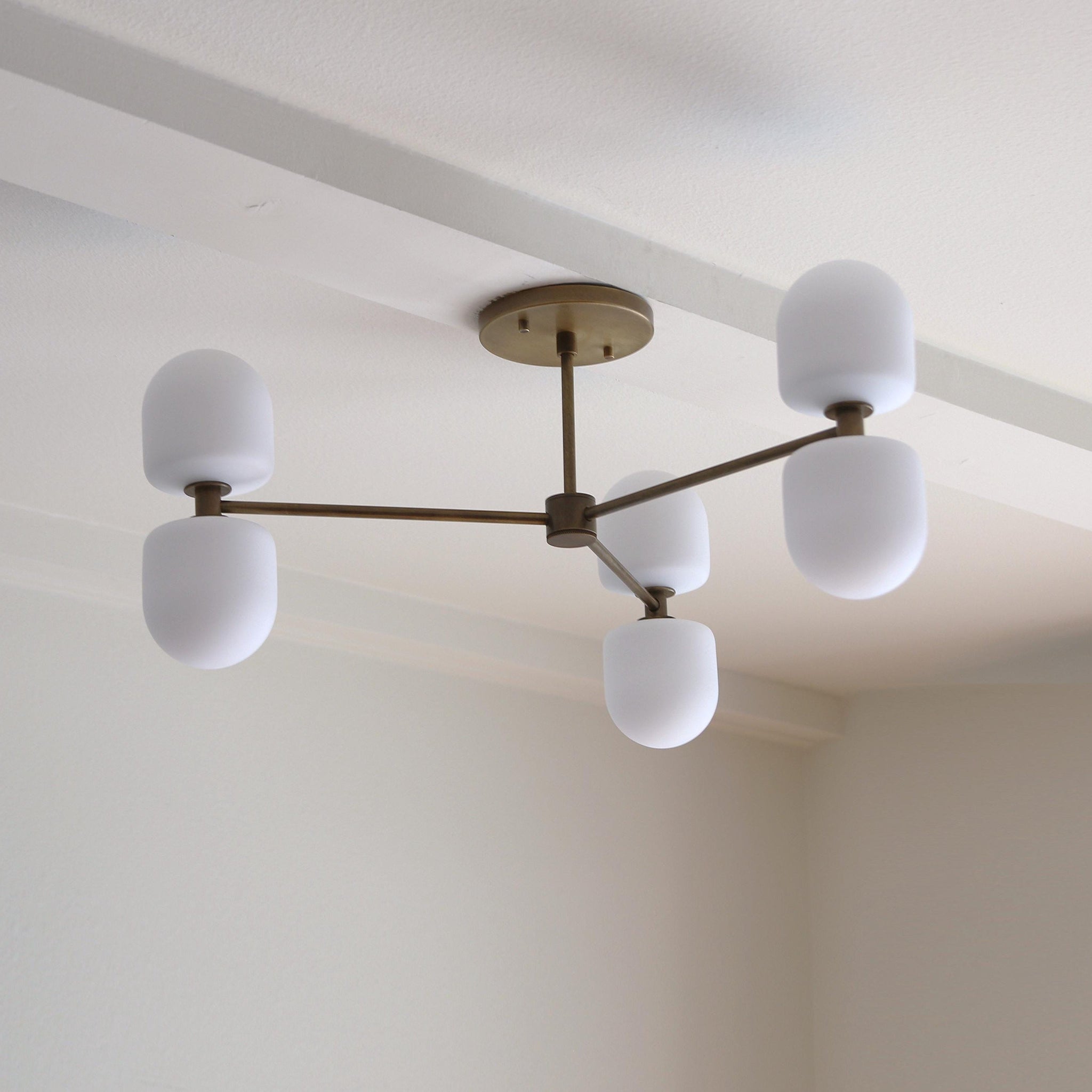 Six-Light Brass Chandelier with Opal Capsule Shades