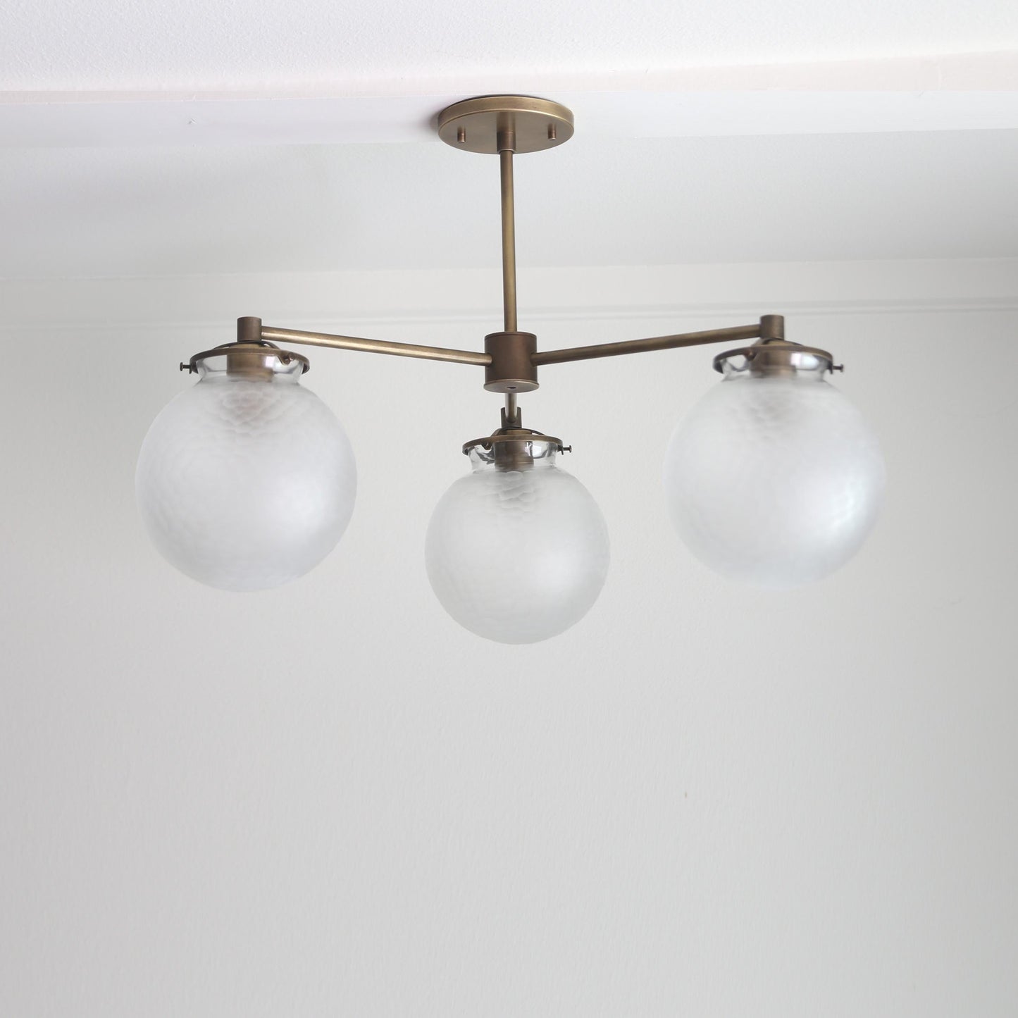 Three-Light Brass Chandelier with Frosted Globes
