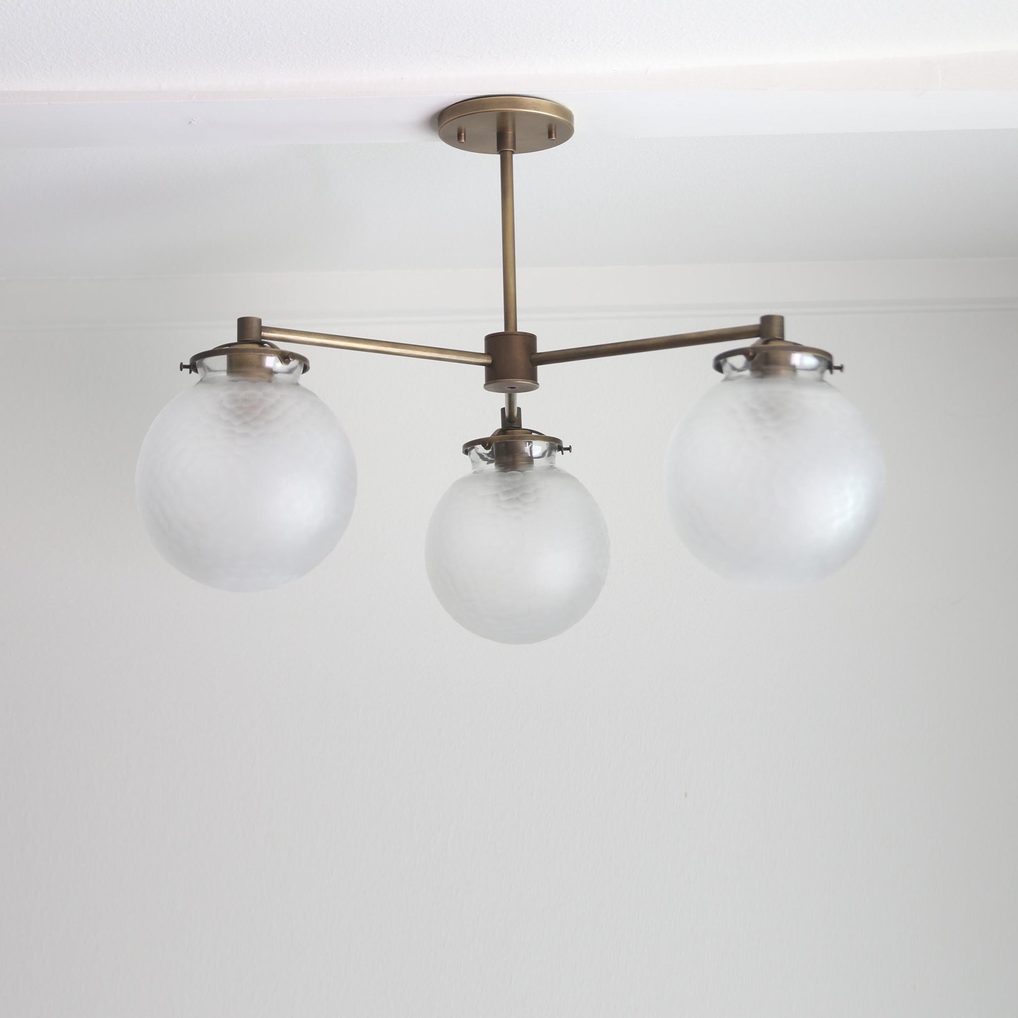 Three-Light Brass Chandelier with Frosted Globes