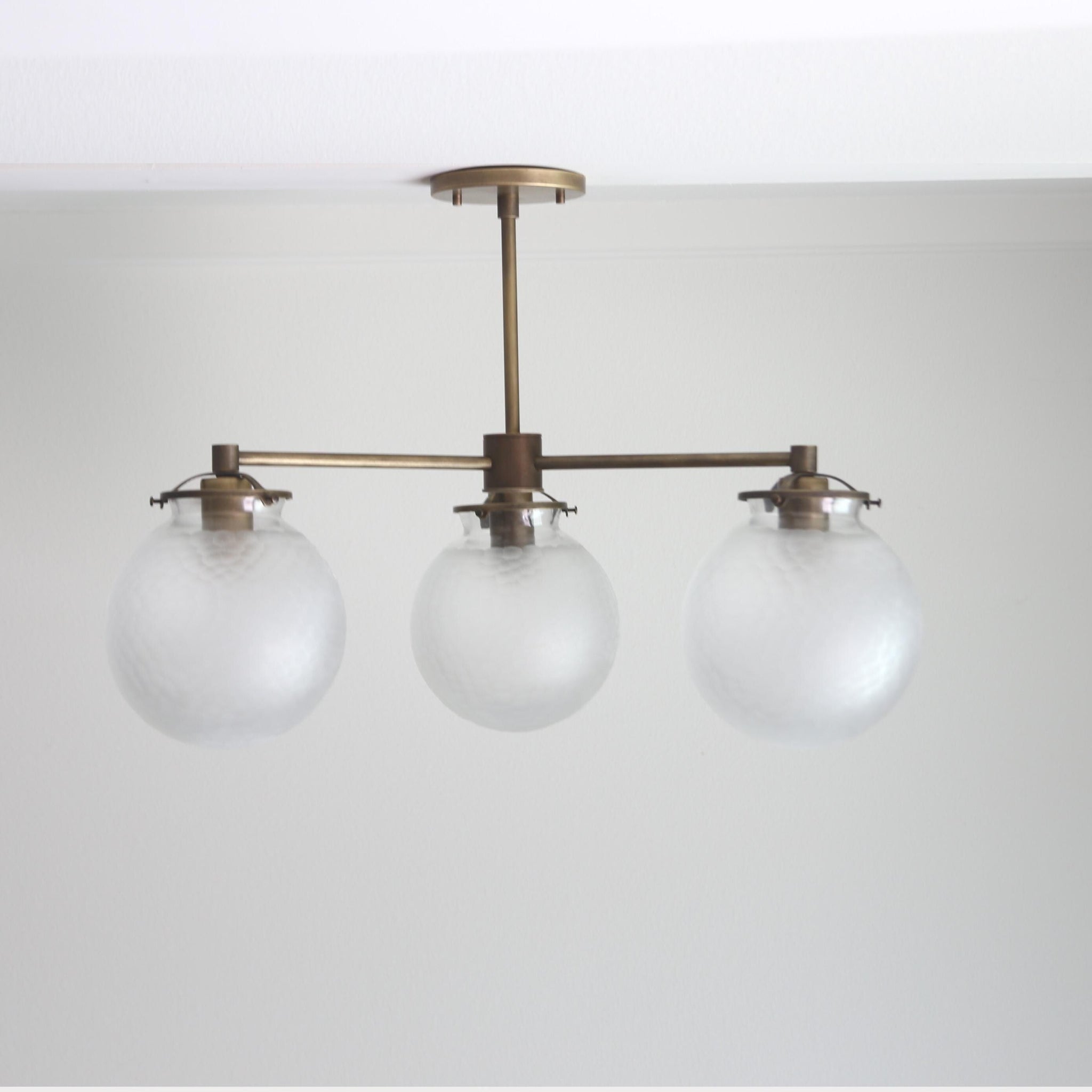 Three-Light Brass Chandelier with Frosted Globes
