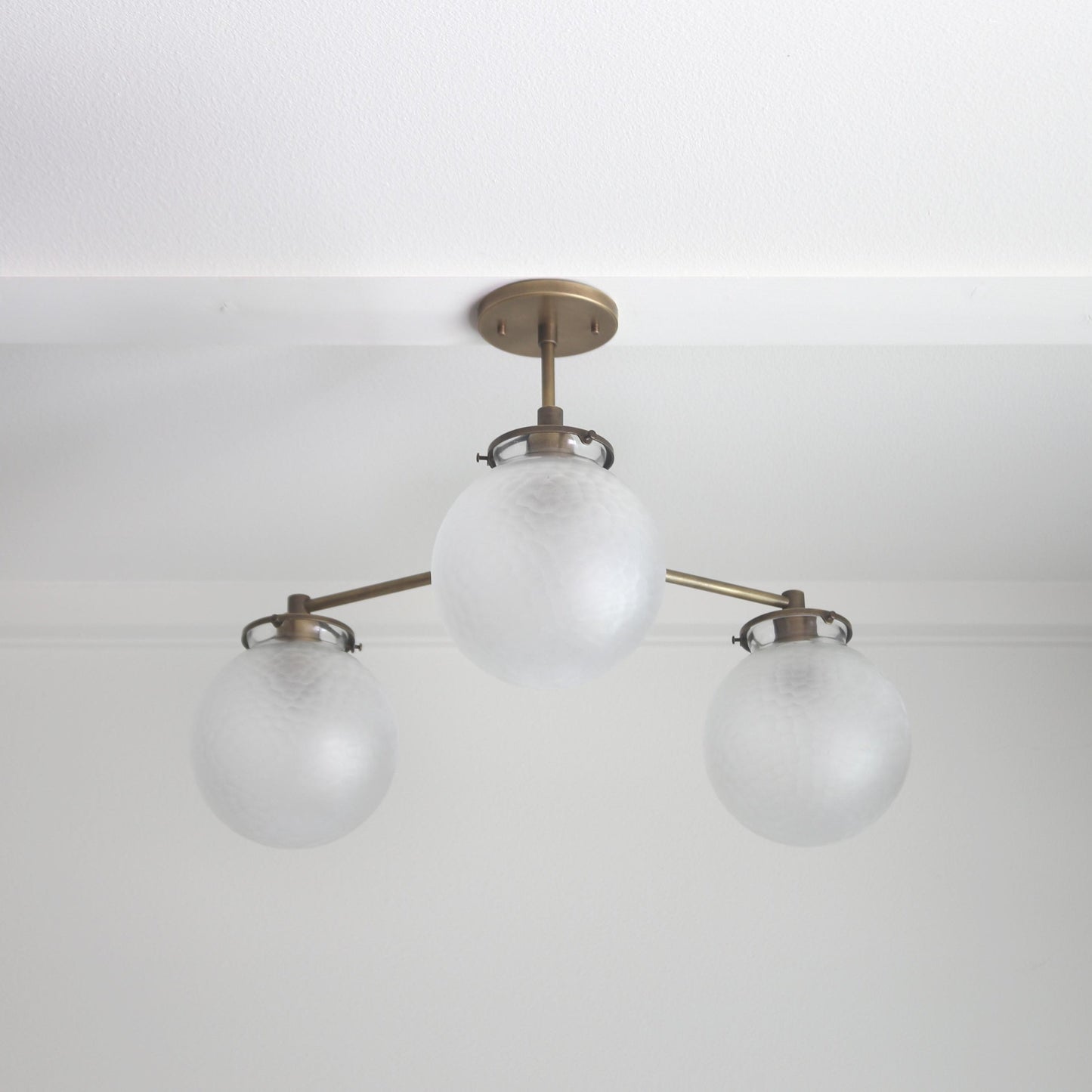 Three-Light Brass Chandelier with Frosted Globes