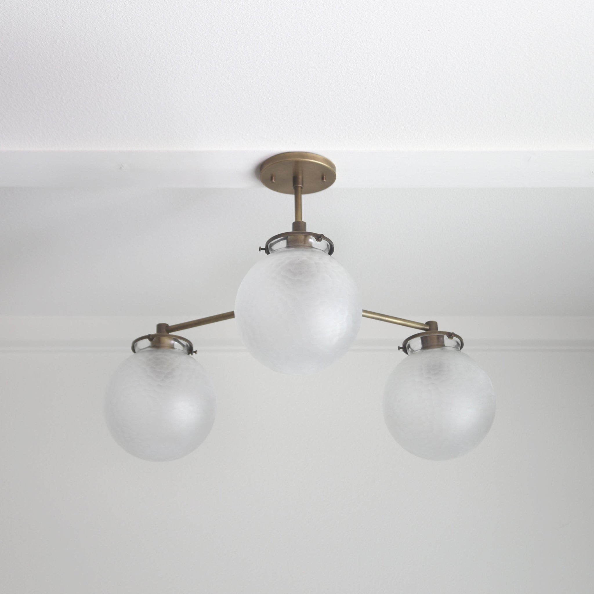 Three-Light Brass Chandelier with Frosted Globes