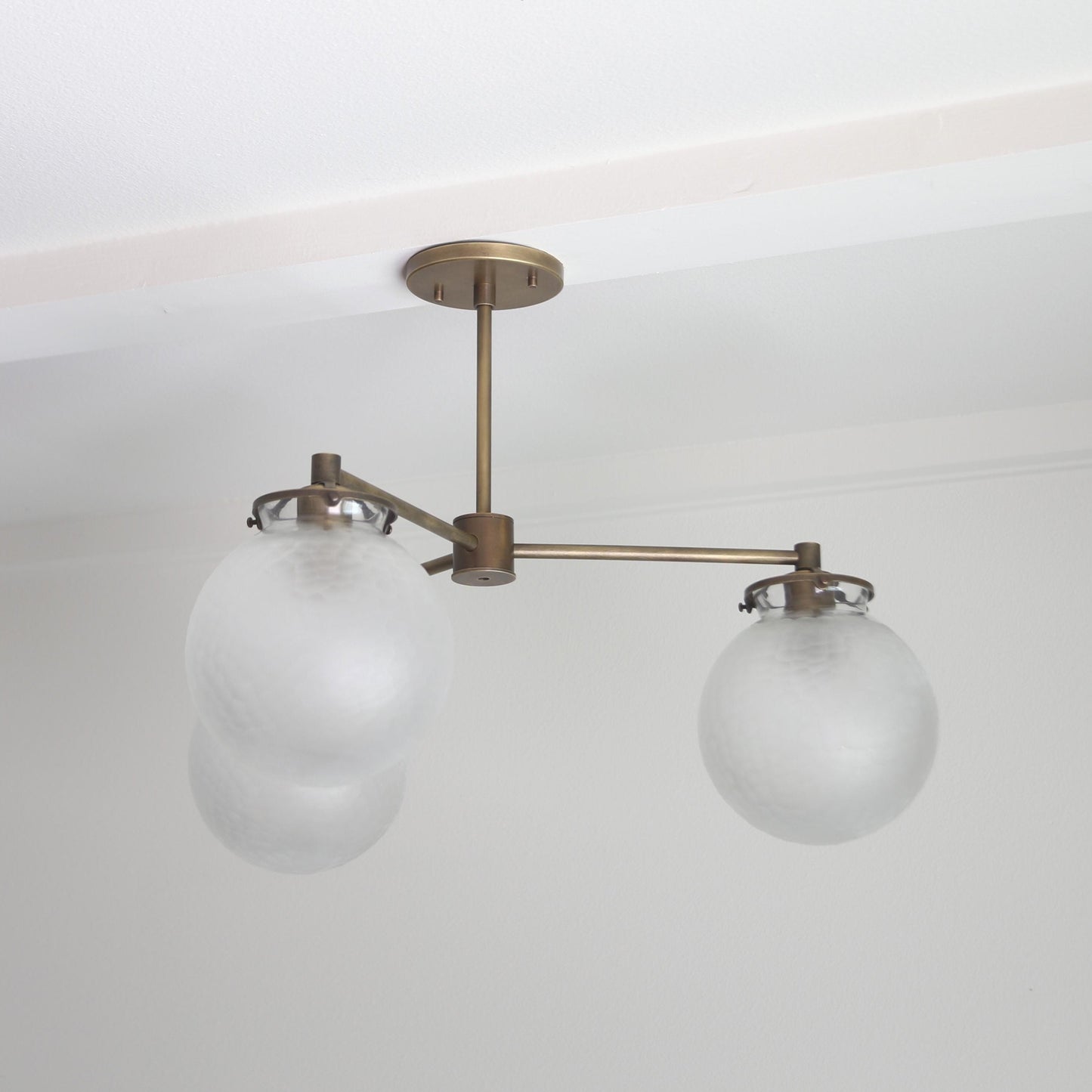 Three-Light Brass Chandelier with Frosted Globes