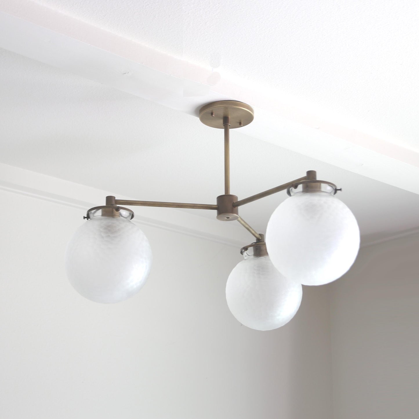 Three-Light Brass Chandelier with Frosted Globes