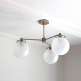 Three-Light Brass Chandelier with Frosted Globes