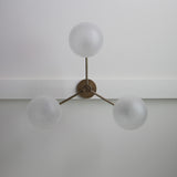 Three-Light Brass Chandelier with Frosted Globes