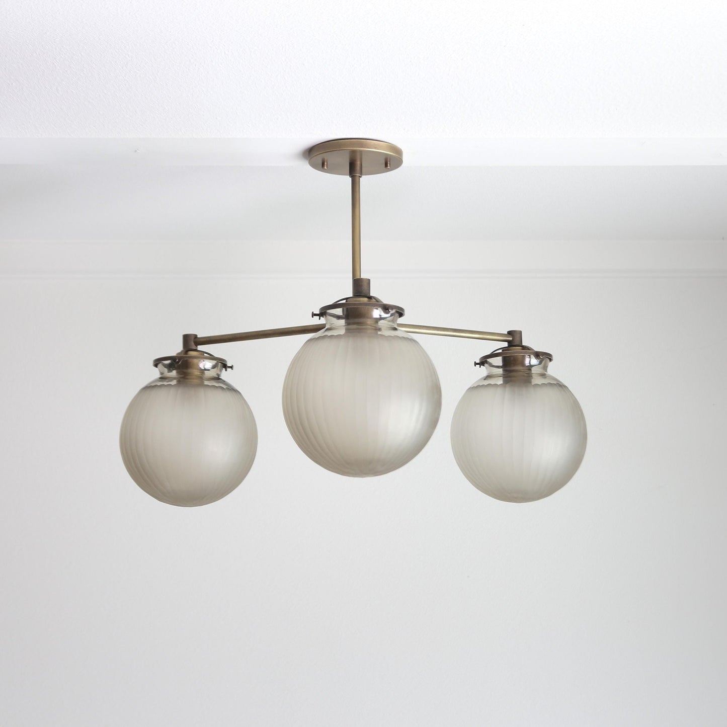 Three-Light Brass Chandelier with Frosted Globes