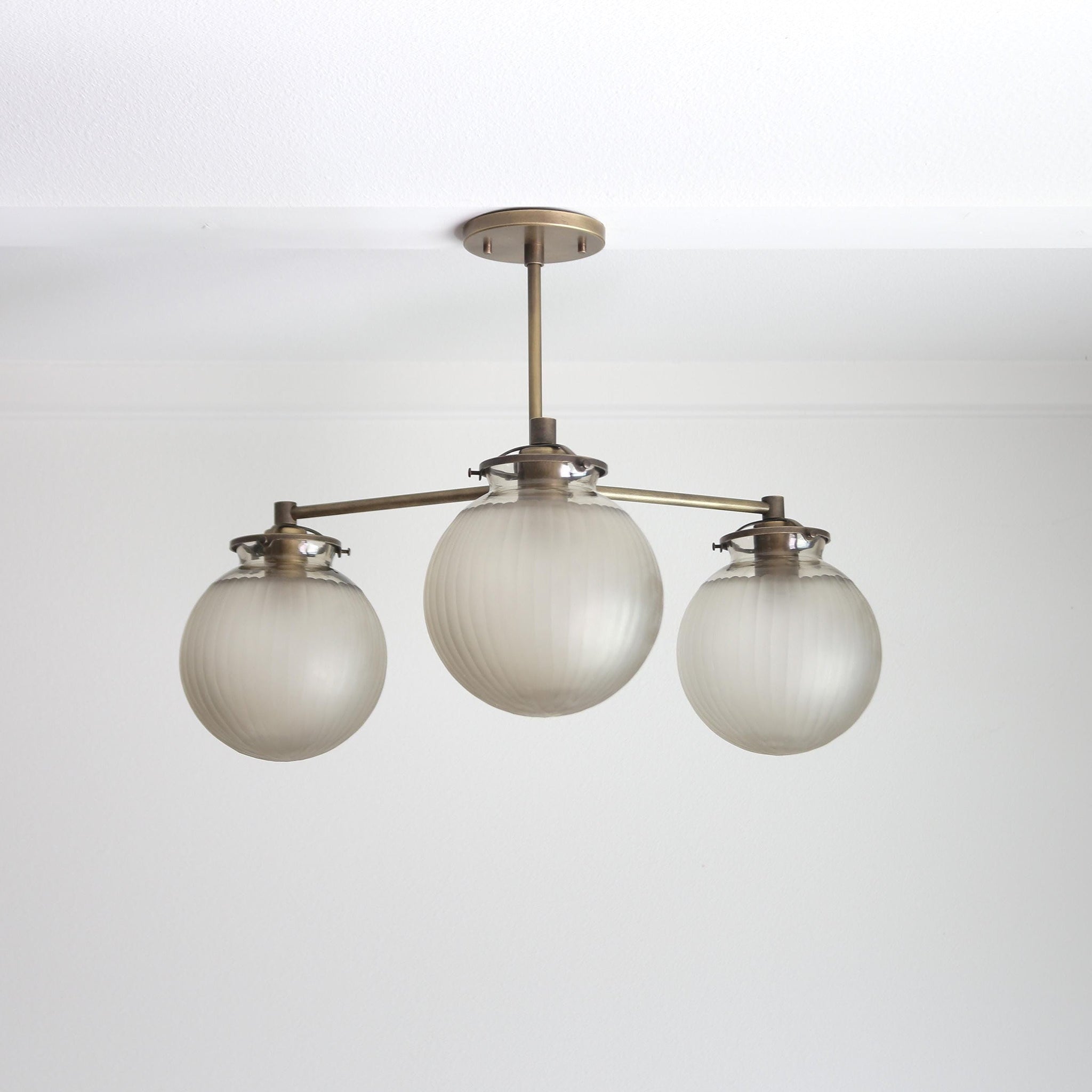 Three-Light Brass Chandelier with Frosted Globes