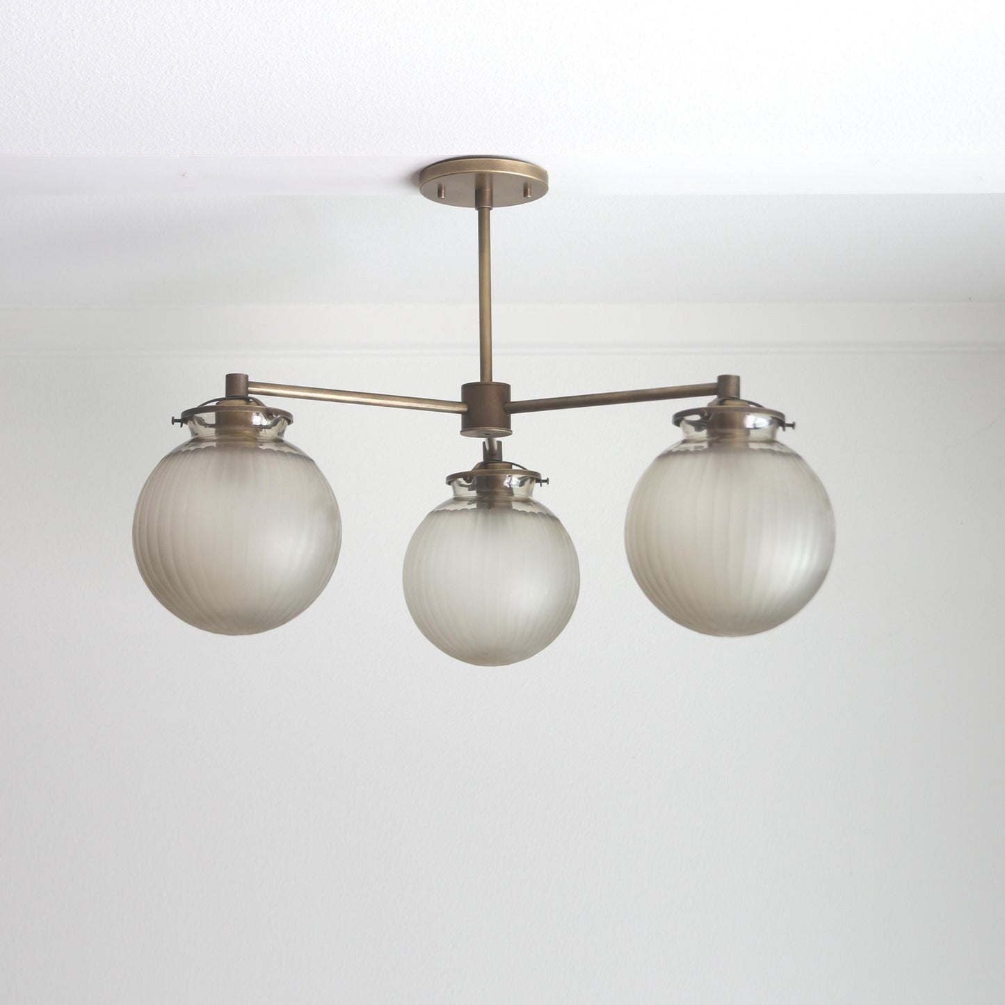 Three-Light Brass Chandelier with Frosted Globes