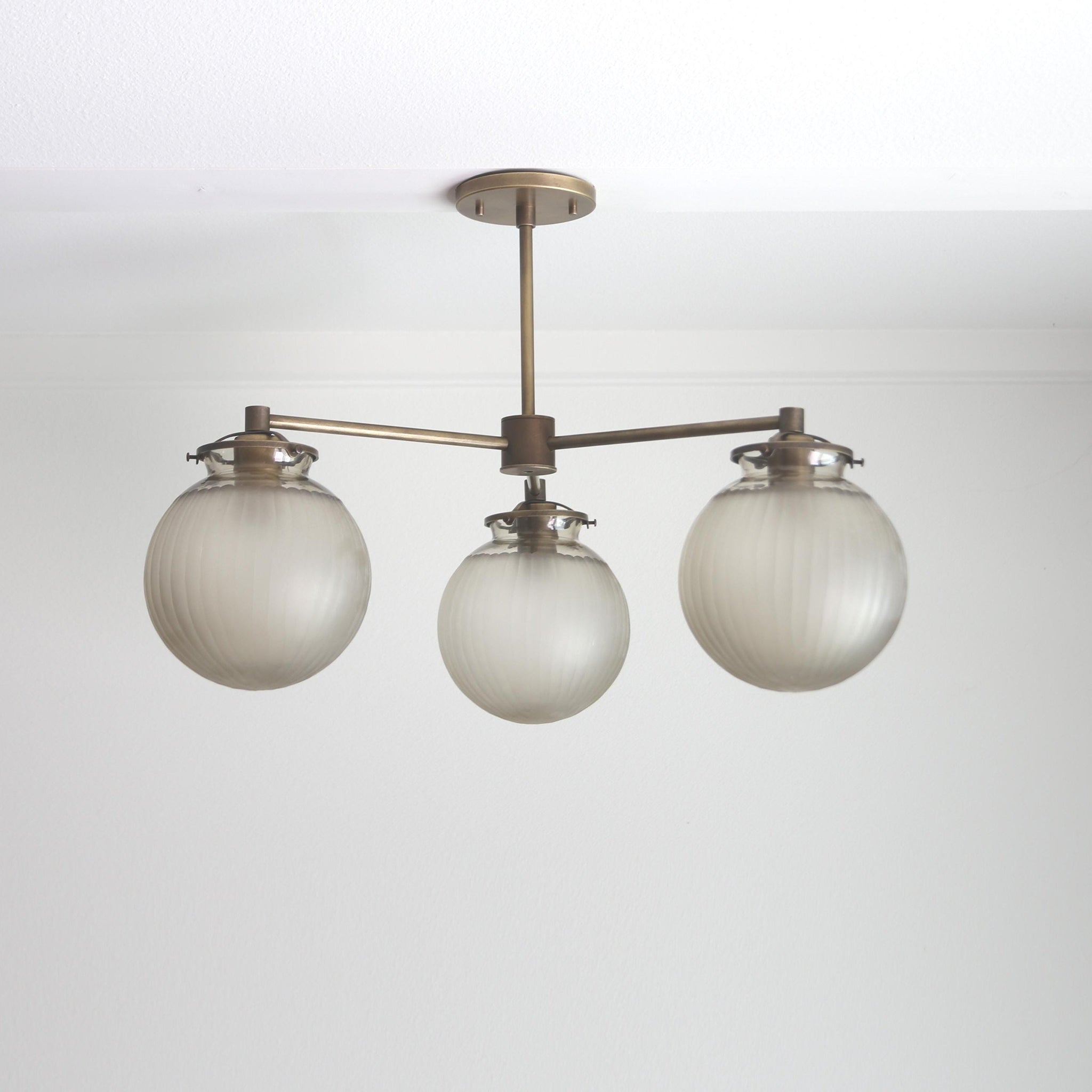 Three-Light Brass Chandelier with Frosted Globes