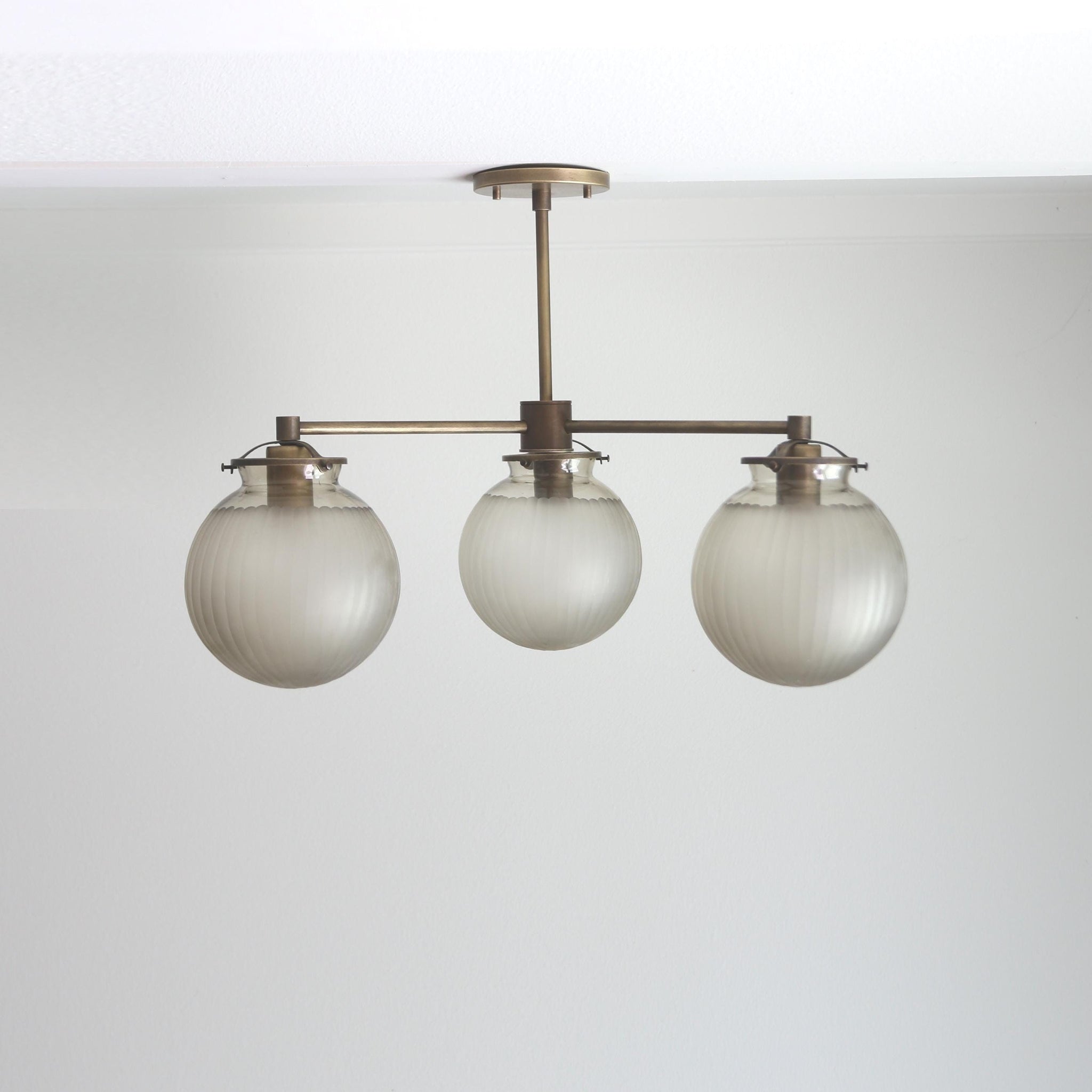 Three-Light Brass Chandelier with Frosted Globes