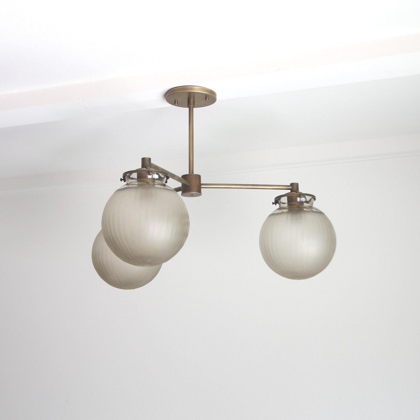 Three-Light Brass Chandelier with Frosted Globes