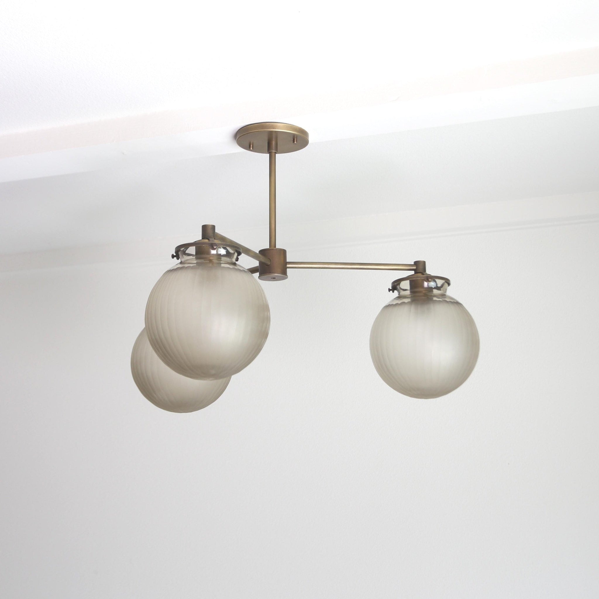 Three-Light Brass Chandelier with Frosted Globes