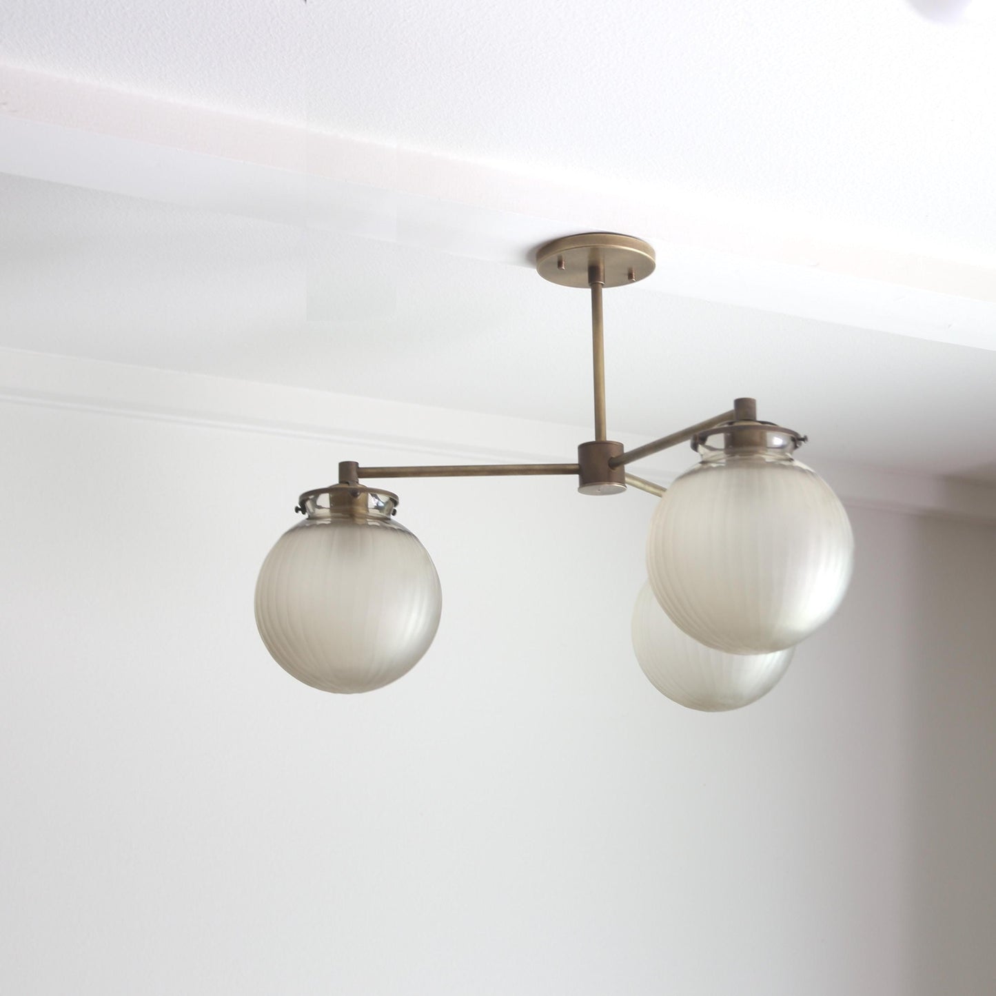 Three-Light Brass Chandelier with Frosted Globes