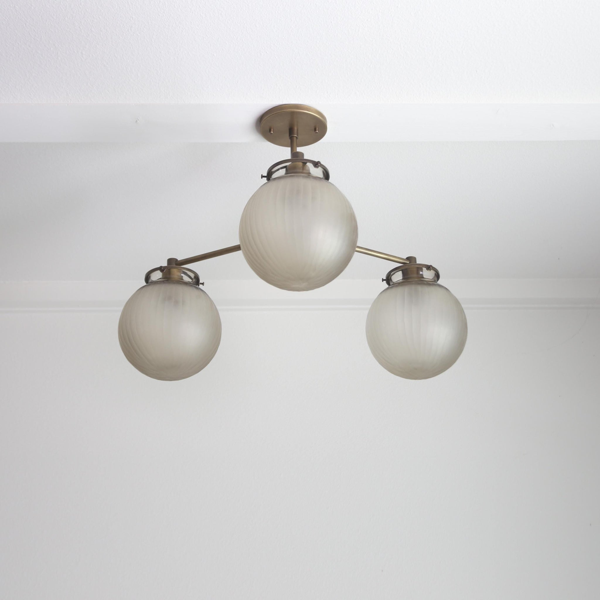 Three-Light Brass Chandelier with Frosted Globes
