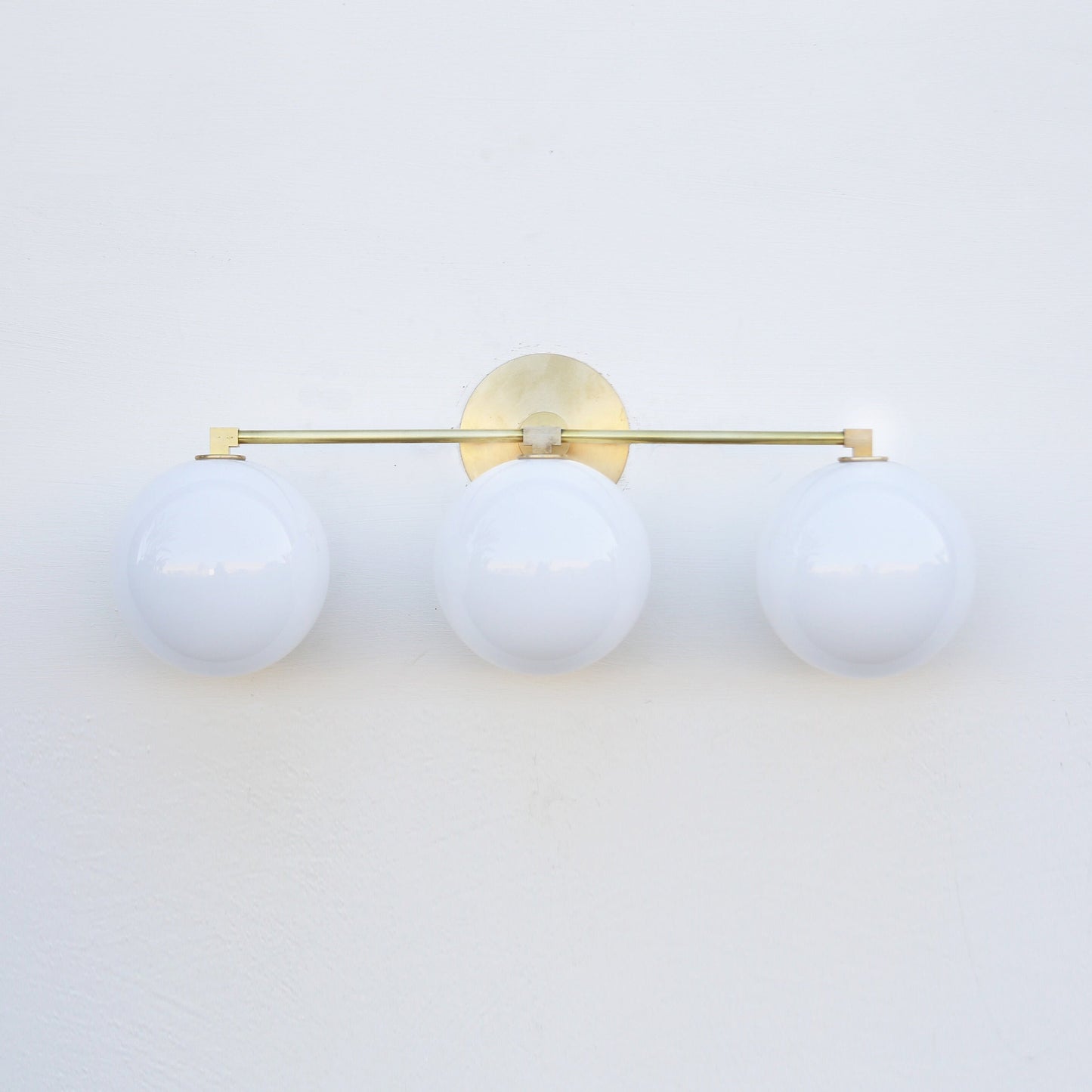Three-Light Brass Vanity Sconce with Six-Inch Opal Globes