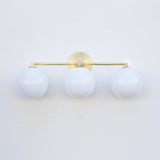 Three-Light Brass Vanity Sconce with Six-Inch Opal Globes
