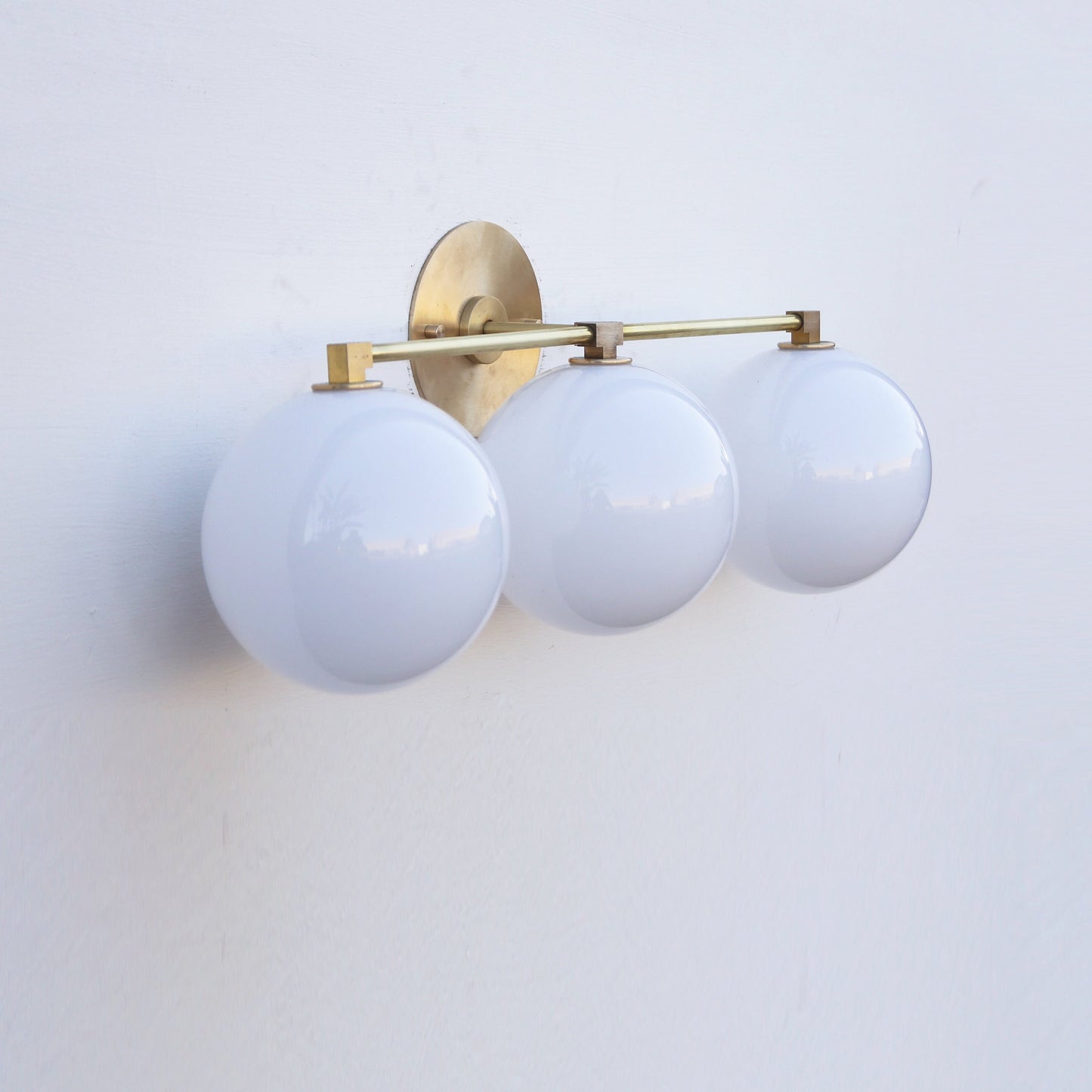 Three-Light Brass Vanity Sconce with Six-Inch Opal Globes