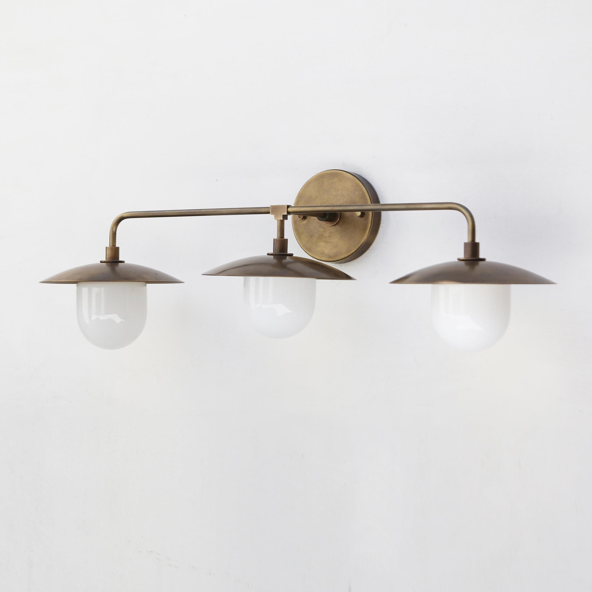 Three-Light Brass Wall Sconce with Disc Shades