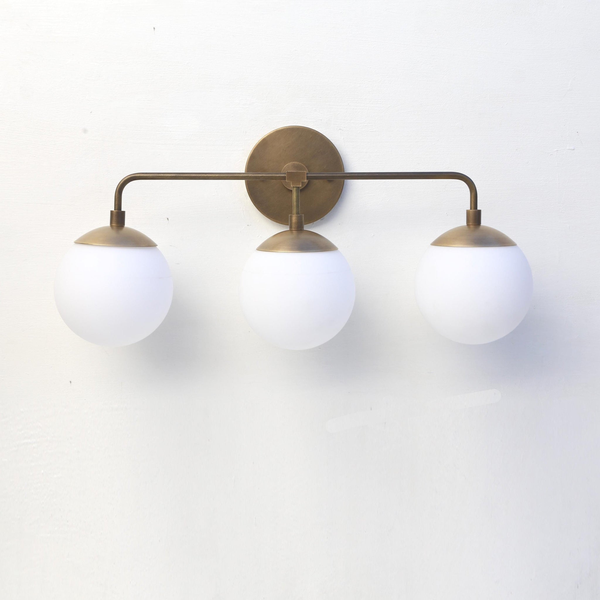 Three-Light Brass Wall Sconce with Opal Glass Globes