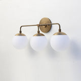 Three-Light Brass Wall Sconce with Opal Glass Globes
