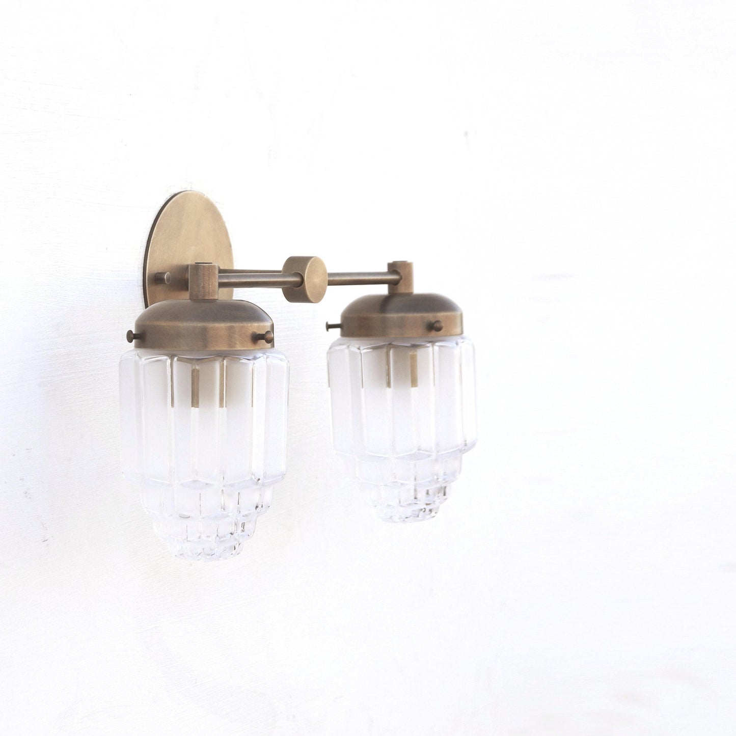 Two-Light Brass Vanity Sconce with Fluted Glass Shades