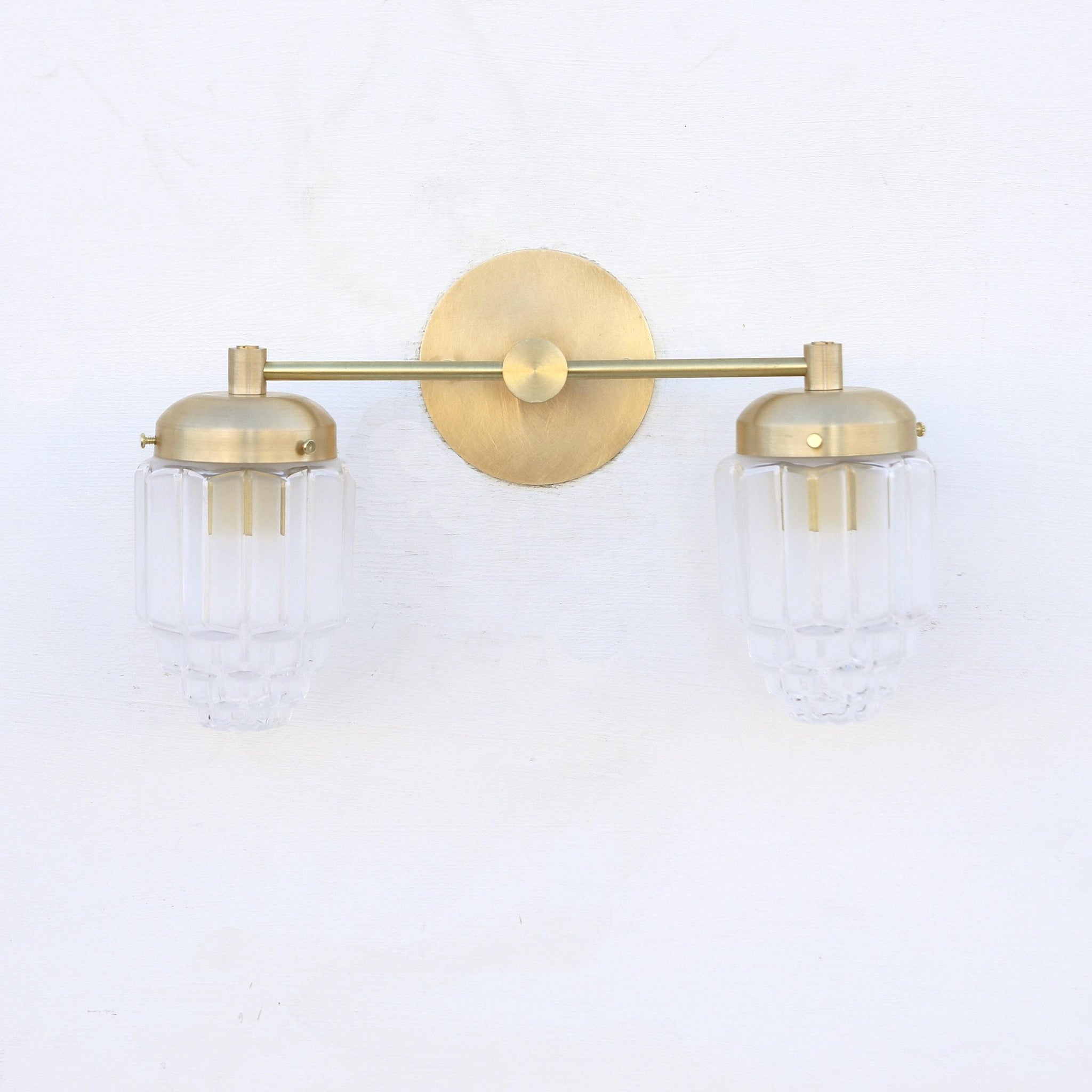 Two-Light Brass Vanity Sconce with Fluted Glass Shades