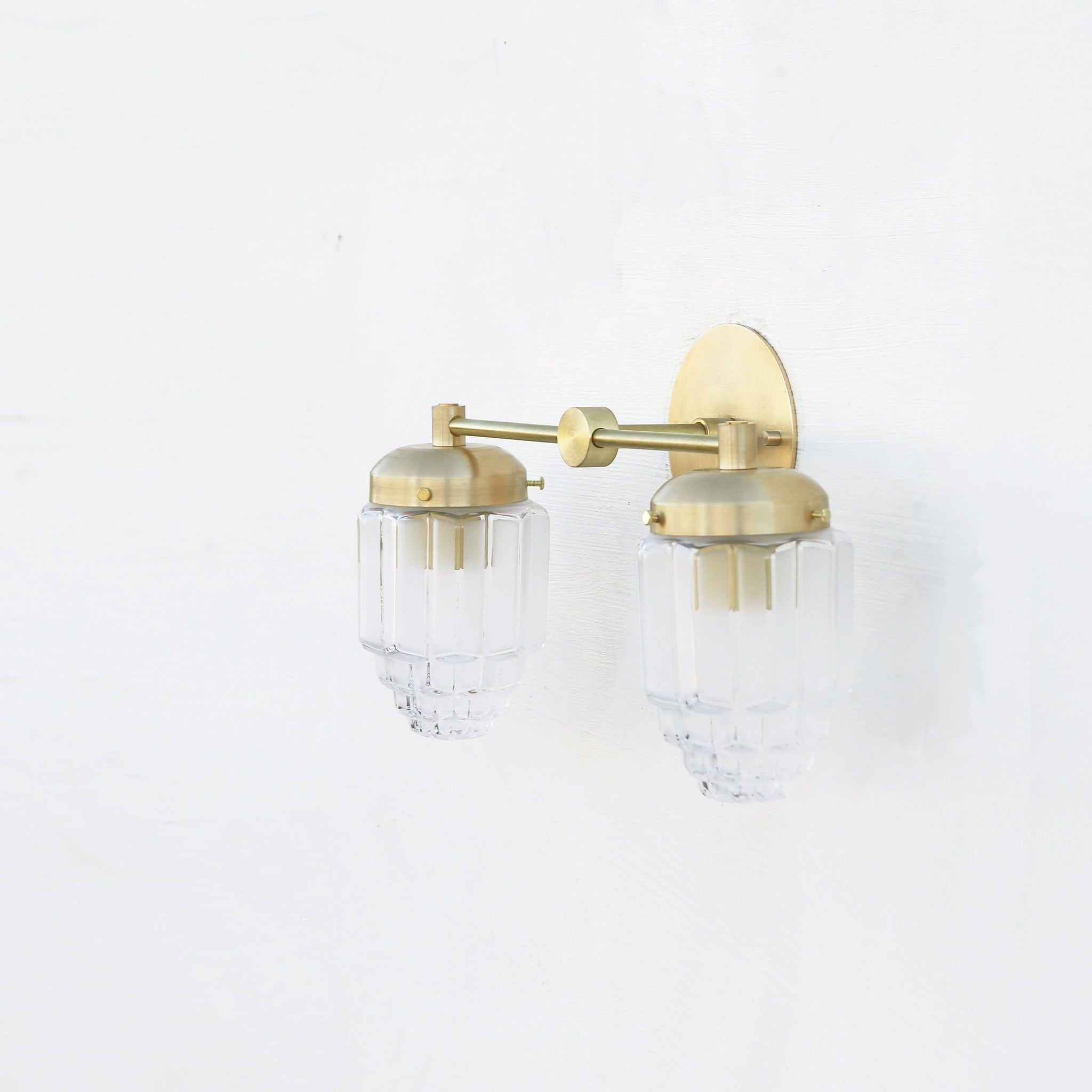 Two-Light Brass Vanity Sconce with Fluted Glass Shades