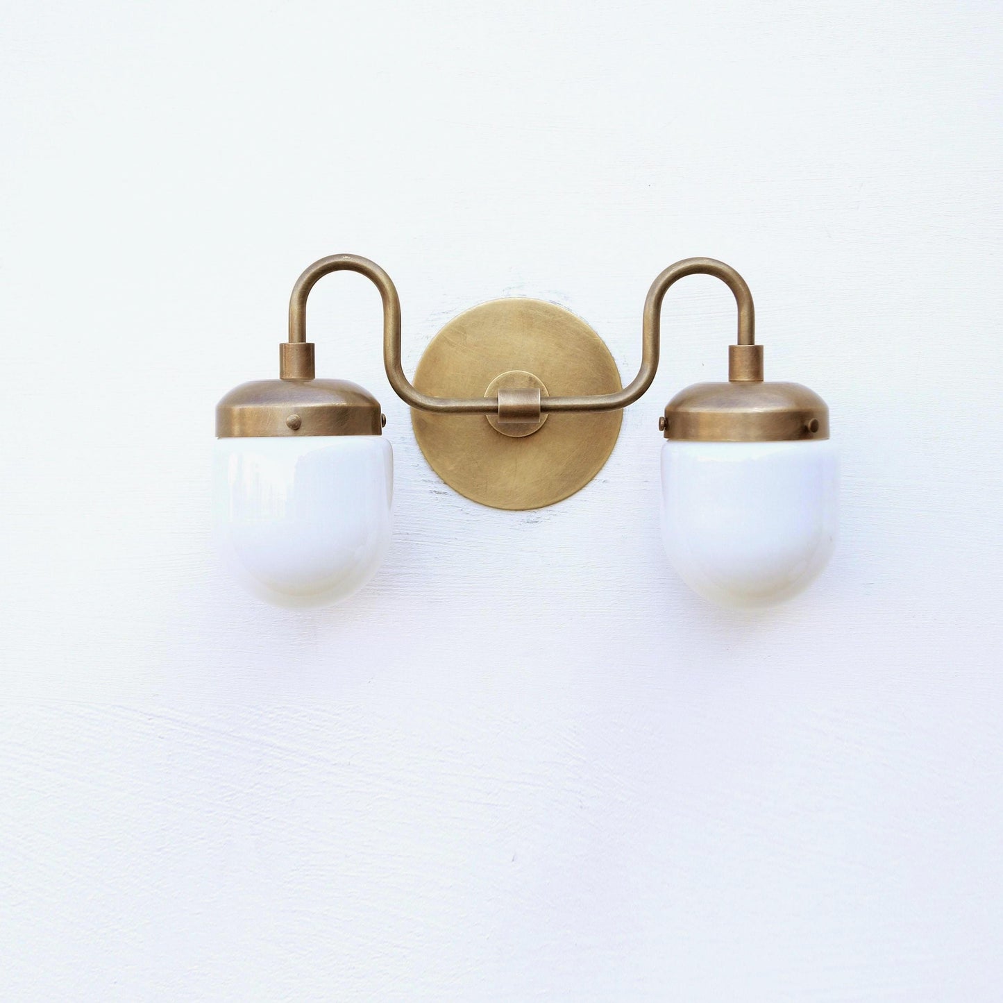 Two-Light Brass Vanity Sconce with Opal Capsule Shades