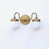 Two-Light Brass Vanity Sconce with Opal Capsule Shades
