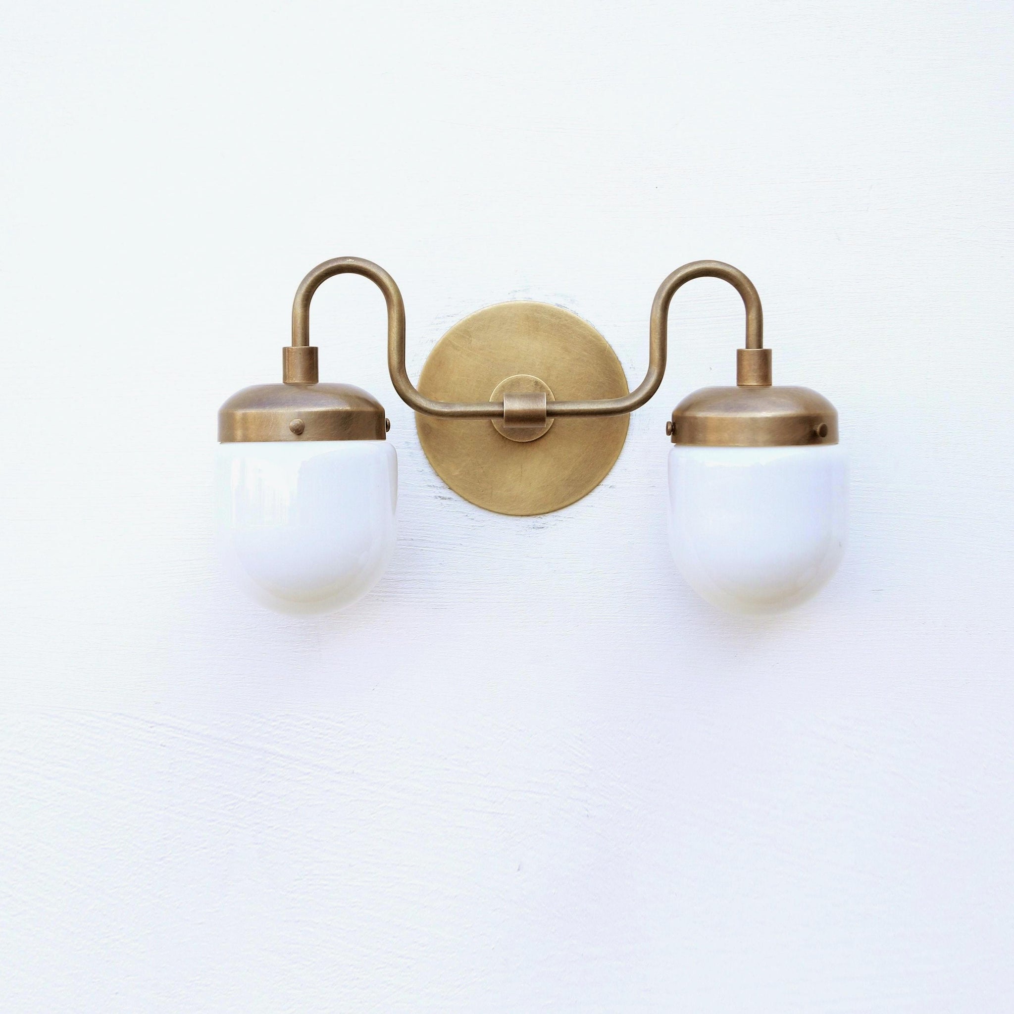 Two-Light Brass Vanity Sconce with Opal Capsule Shades