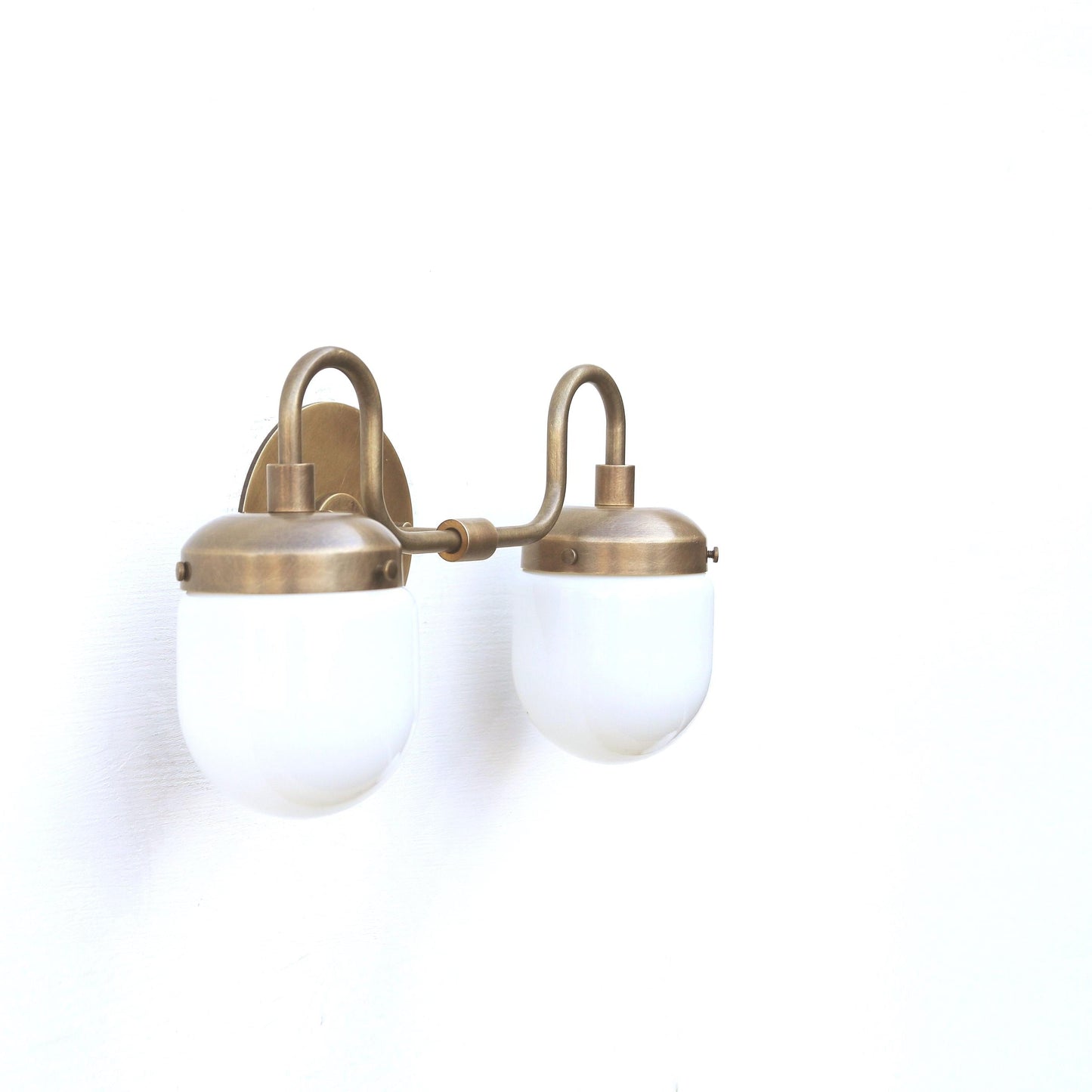 Two-Light Brass Vanity Sconce with Opal Capsule Shades