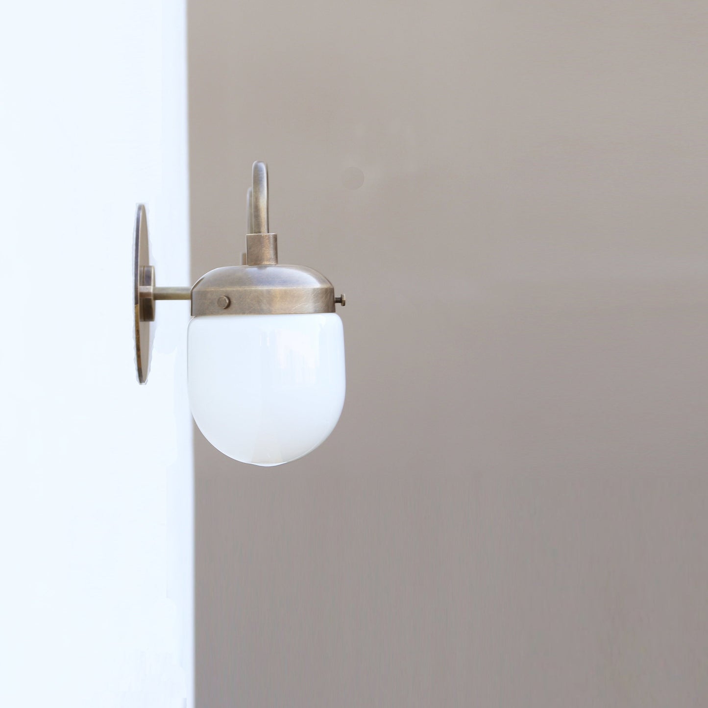 Two-Light Brass Vanity Sconce with Opal Capsule Shades