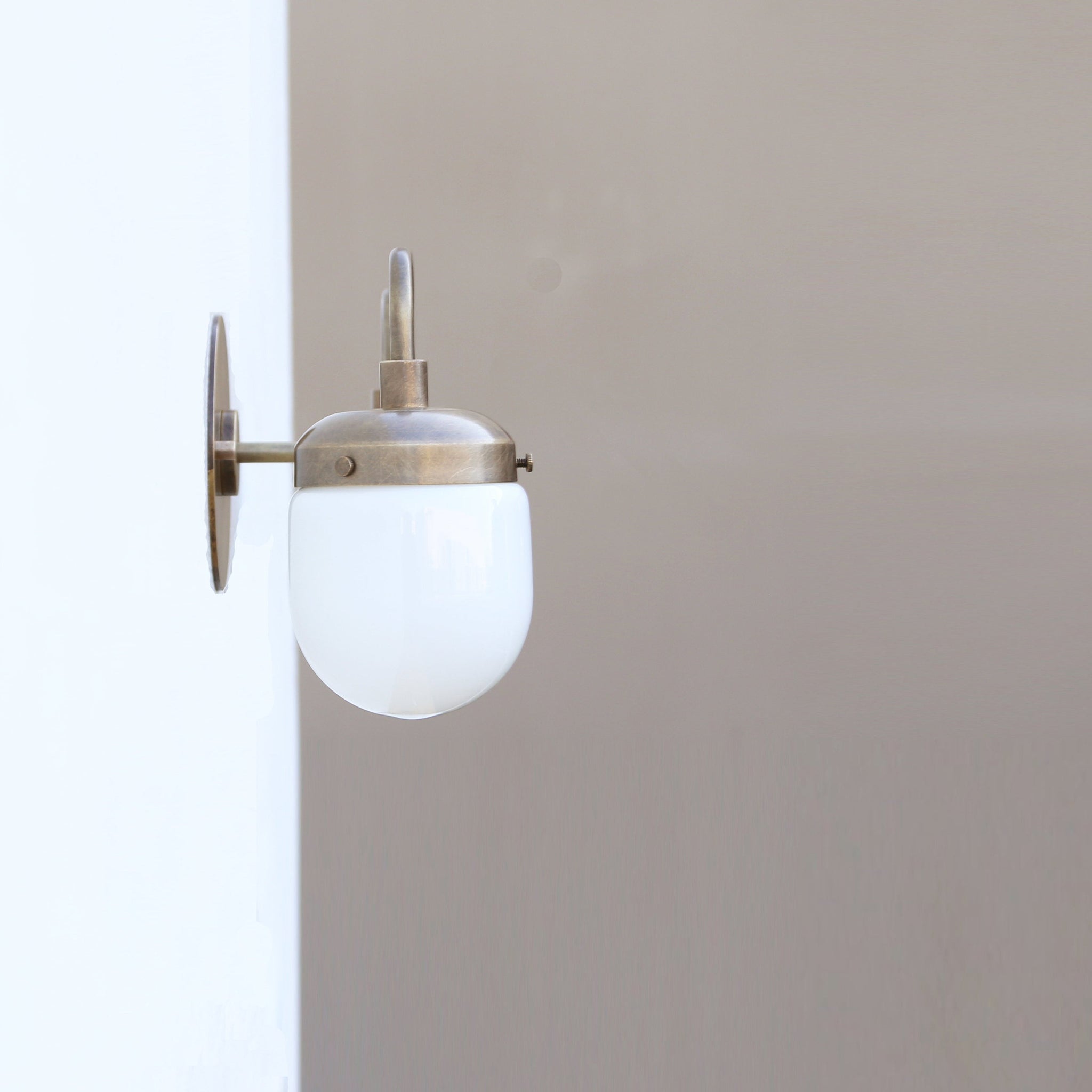 Two-Light Brass Vanity Sconce with Opal Capsule Shades