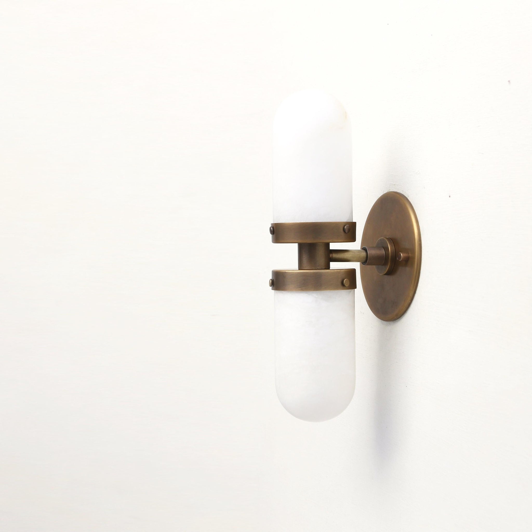 Two-Light Brass Wall Sconce with Clamped Alabaster Capsules
